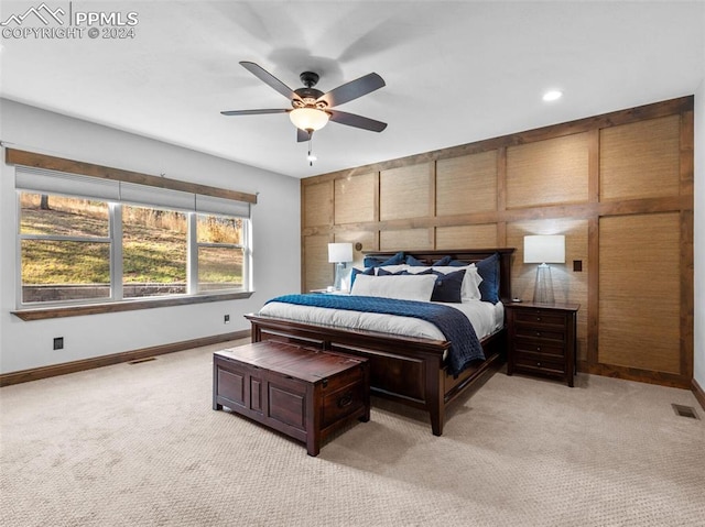 bedroom featuring ceiling fan and light colored carpet