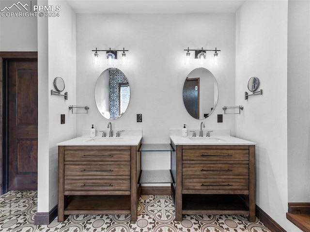 bathroom with tile patterned flooring and vanity