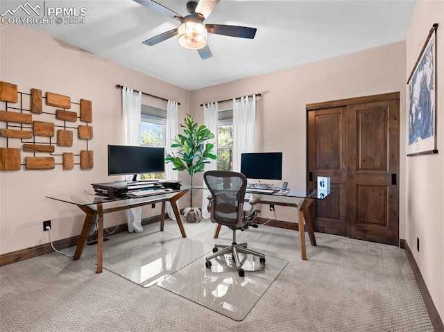 carpeted office with ceiling fan