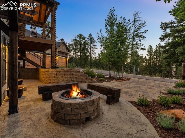 patio terrace at dusk with an outdoor fire pit