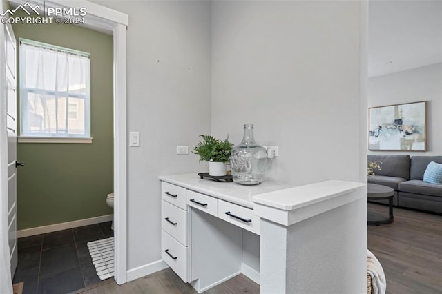 interior space featuring white cabinets and dark hardwood / wood-style floors