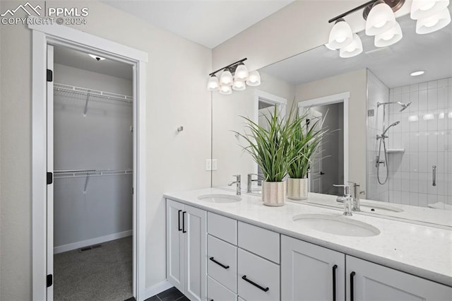 bathroom featuring vanity and a shower with shower door