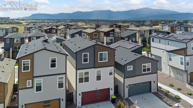 birds eye view of property with a mountain view