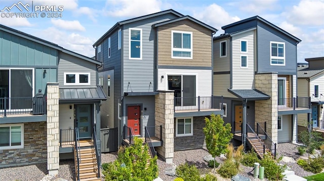 view of front of home with a balcony