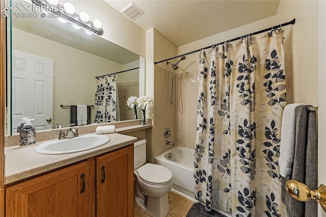 full bathroom with vanity, tile patterned floors, toilet, and shower / bath combo