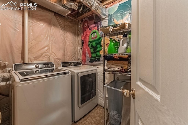 washroom featuring washer and clothes dryer