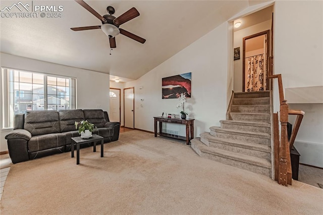 living room with lofted ceiling, carpet, and ceiling fan