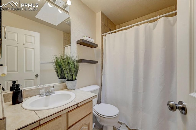 bathroom featuring vanity, toilet, and walk in shower