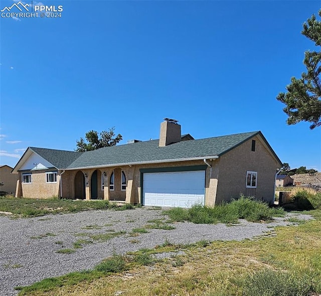 view of front of house with a garage