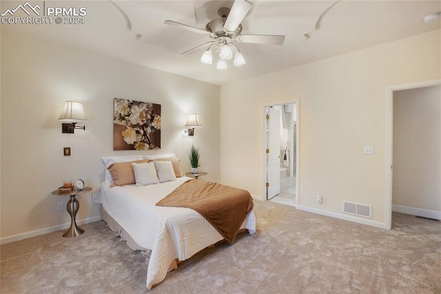 carpeted bedroom featuring connected bathroom and ceiling fan