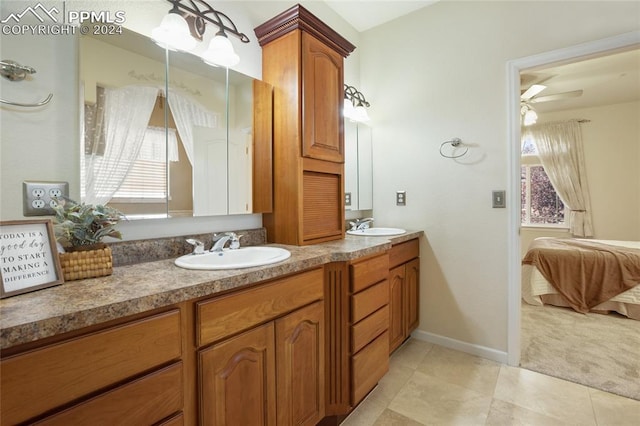 bathroom with tile patterned flooring, vanity, ceiling fan, and plenty of natural light