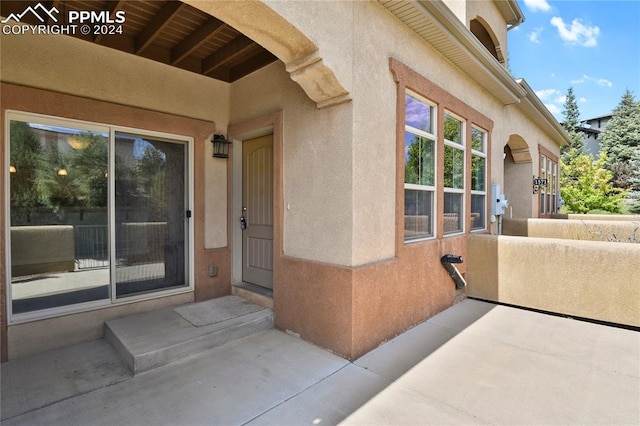 entrance to property featuring a patio area