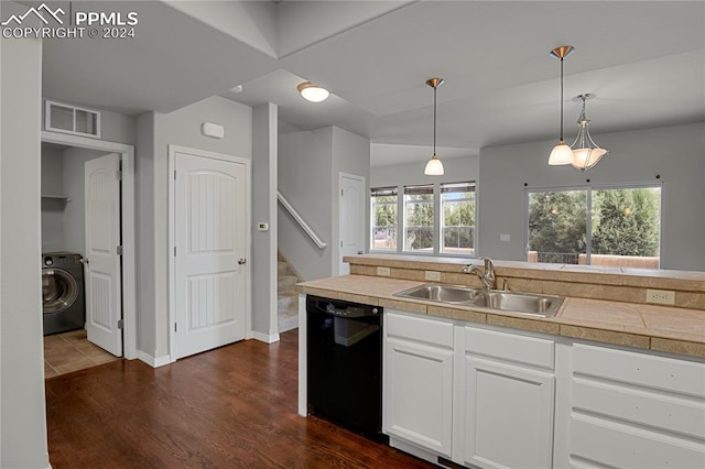 kitchen featuring white cabinets, dishwasher, sink, dark hardwood / wood-style floors, and washer / clothes dryer