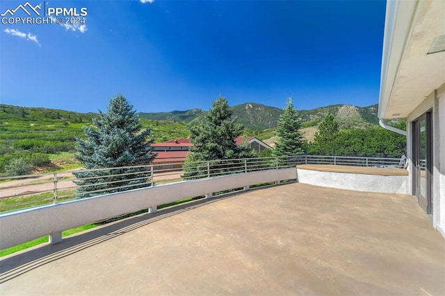 view of patio / terrace featuring a balcony and a mountain view