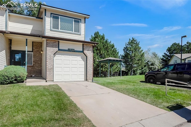 view of front facade featuring a front lawn and a garage