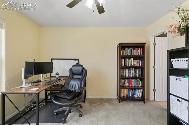 office with ceiling fan and light carpet