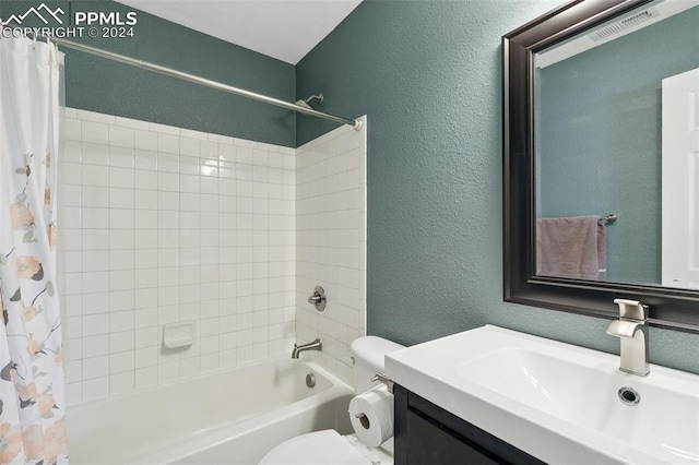 full bathroom featuring shower / bathtub combination with curtain, toilet, and vanity