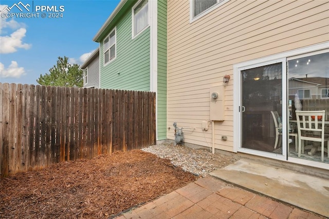 view of side of property with a patio