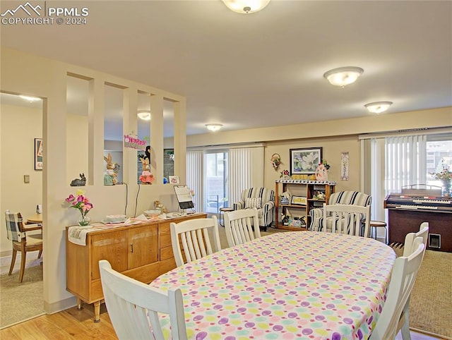 dining room with light wood-type flooring