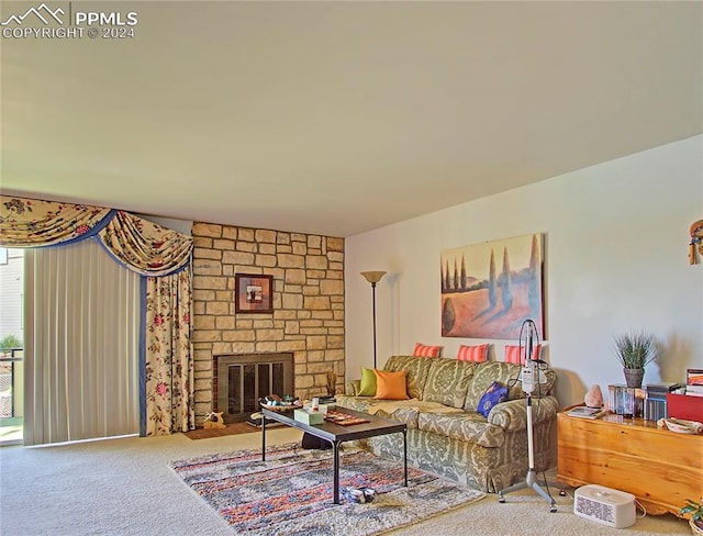 living room with carpet floors and a stone fireplace