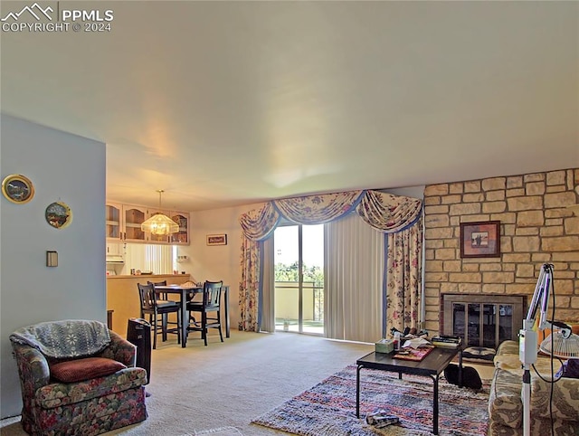 living room with carpet flooring and a fireplace