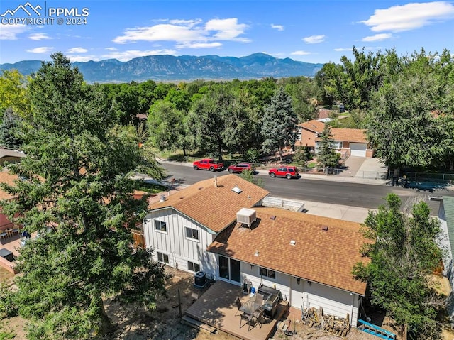 birds eye view of property with a mountain view