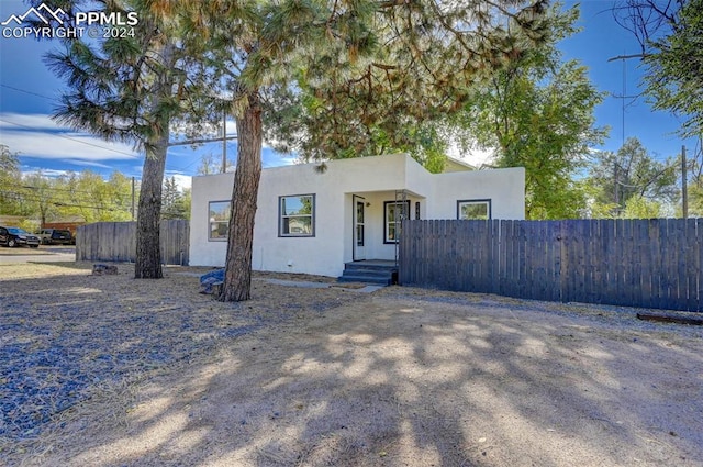 2459 E Willamette Ave, Colorado Springs, CO 80909 - mediterranean / spanish home featuring stucco siding and fence