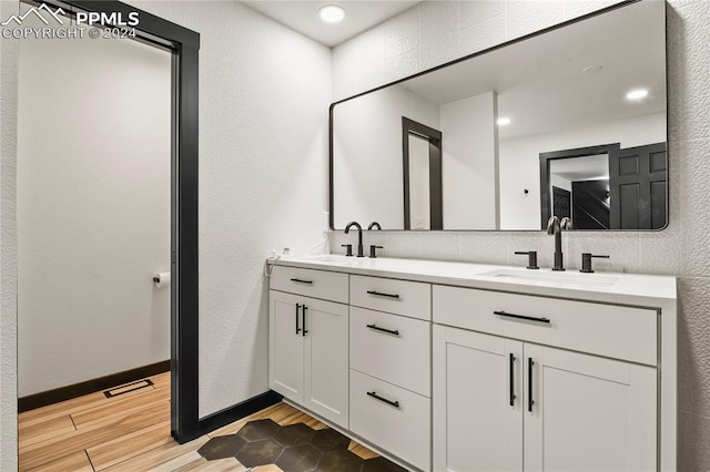 bathroom featuring wood-type flooring and vanity