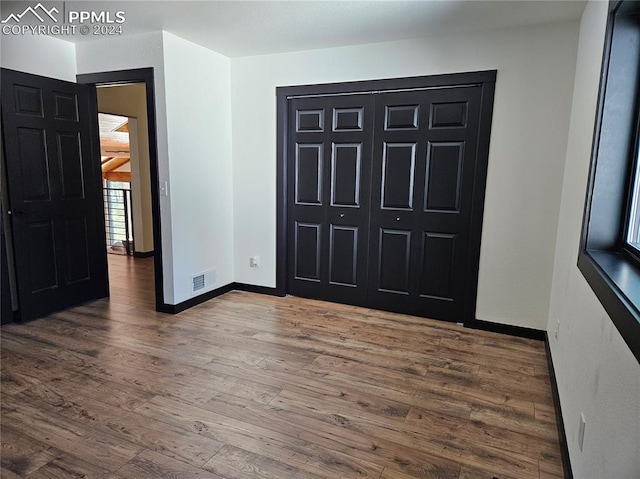 entrance foyer featuring dark wood-type flooring