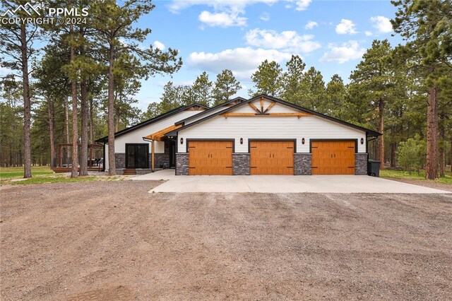 craftsman inspired home with a garage