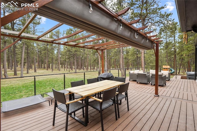 wooden deck with outdoor lounge area, a lawn, a grill, and a pergola