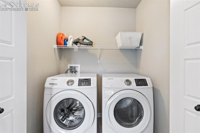 washroom featuring washer and dryer