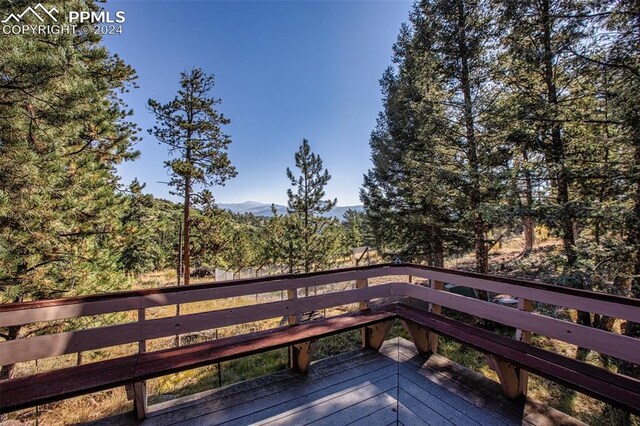 wooden terrace with a mountain view