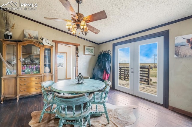 dining space featuring a textured ceiling, dark wood-type flooring, lofted ceiling, ceiling fan, and french doors