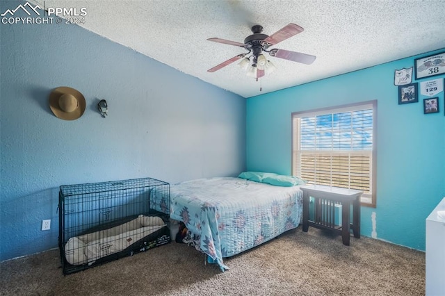 bedroom featuring carpet, ceiling fan, and a textured ceiling