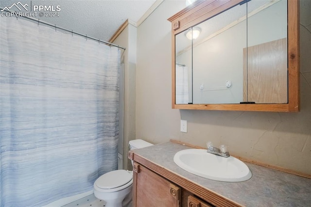 bathroom with vanity, a textured ceiling, ornamental molding, toilet, and a shower with curtain