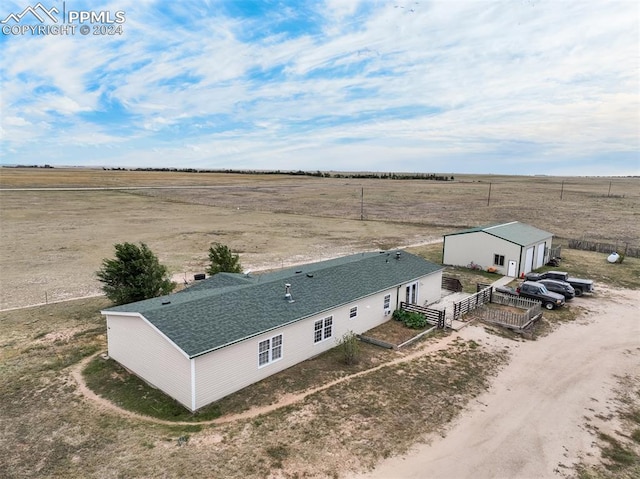 birds eye view of property featuring a rural view