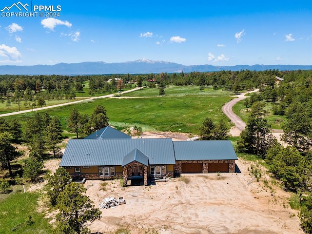 drone / aerial view with a rural view and a mountain view