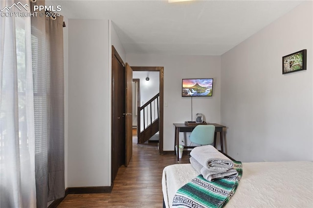 bedroom featuring dark hardwood / wood-style floors