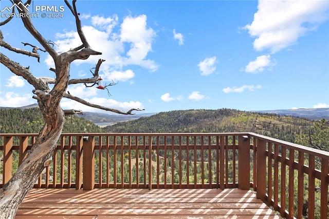 wooden terrace with a mountain view