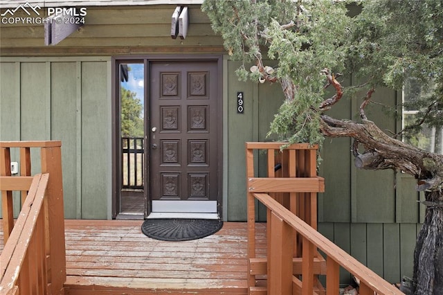 doorway to property featuring a wooden deck