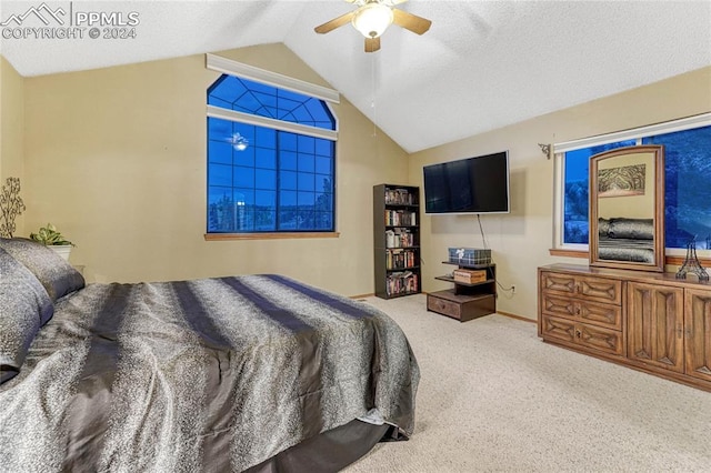 carpeted bedroom featuring lofted ceiling and ceiling fan