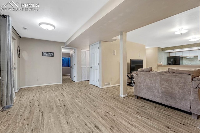 living room with light hardwood / wood-style floors