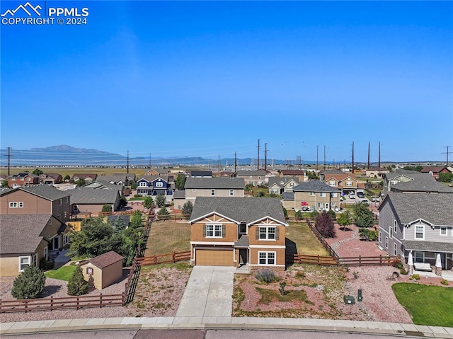 birds eye view of property with a mountain view