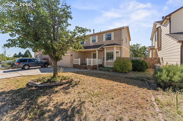 view of front property with a front lawn and a garage