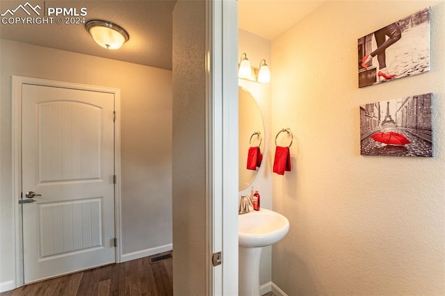 bathroom featuring hardwood / wood-style floors and sink