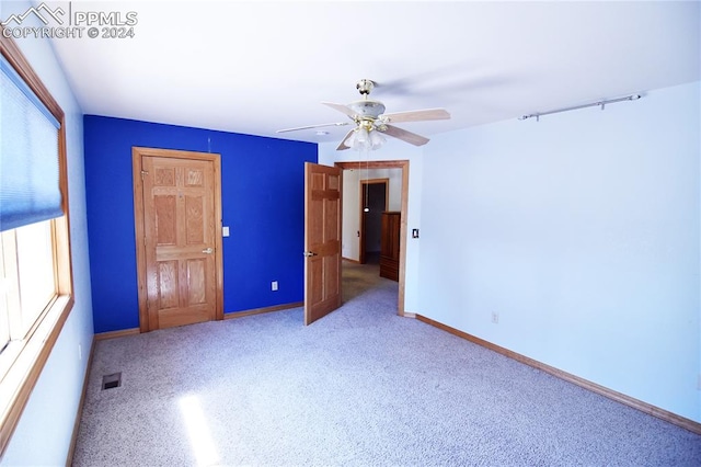 unfurnished bedroom with ceiling fan