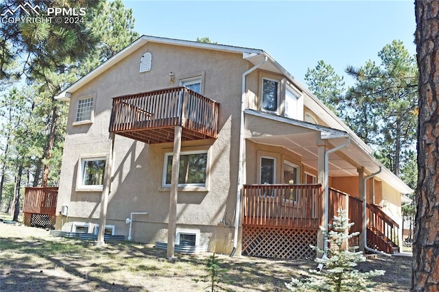 rear view of house with a deck