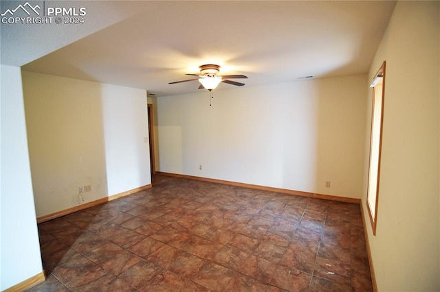 spare room featuring ceiling fan