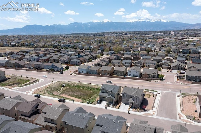 birds eye view of property with a mountain view